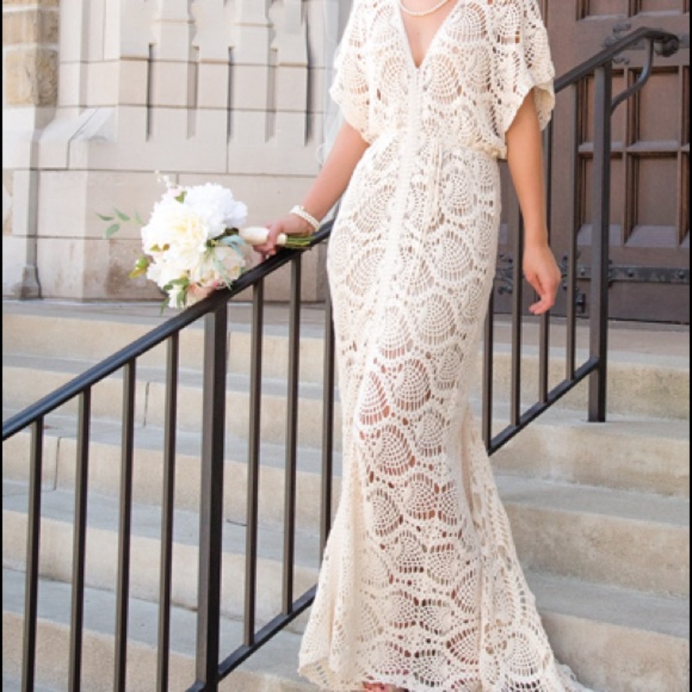 Handmade crocheted and beaded wedding gown. Cream color